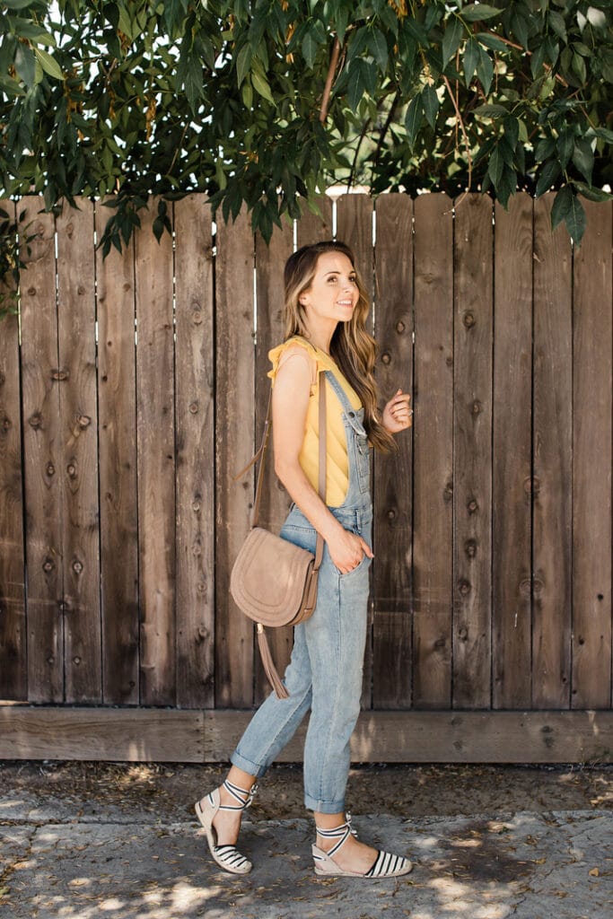 Merrick White shows you how she styles her light wash overalls