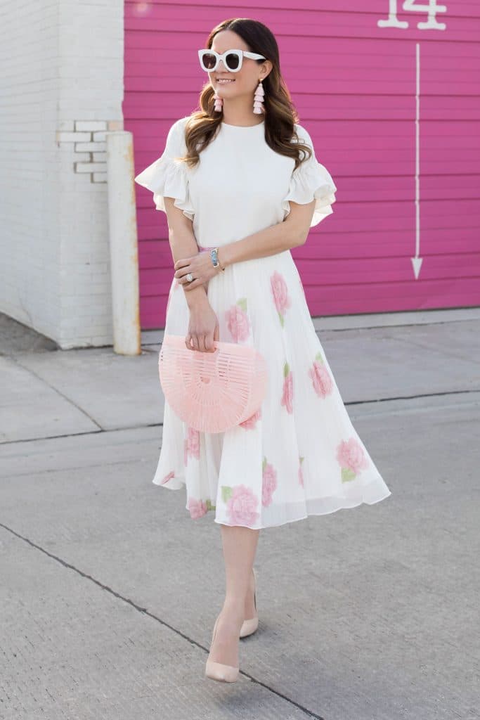 Jennifer Lake's Valentine's outfit featuring a ruffle top and blossom pleated skirt.