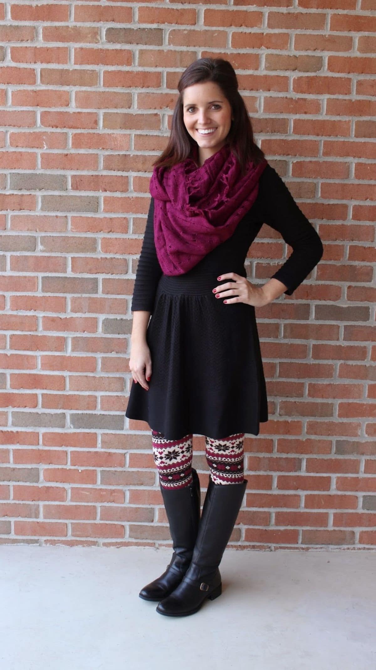 outfit with Nordic print leggings, black dress, dark maroon scarf, and black boots