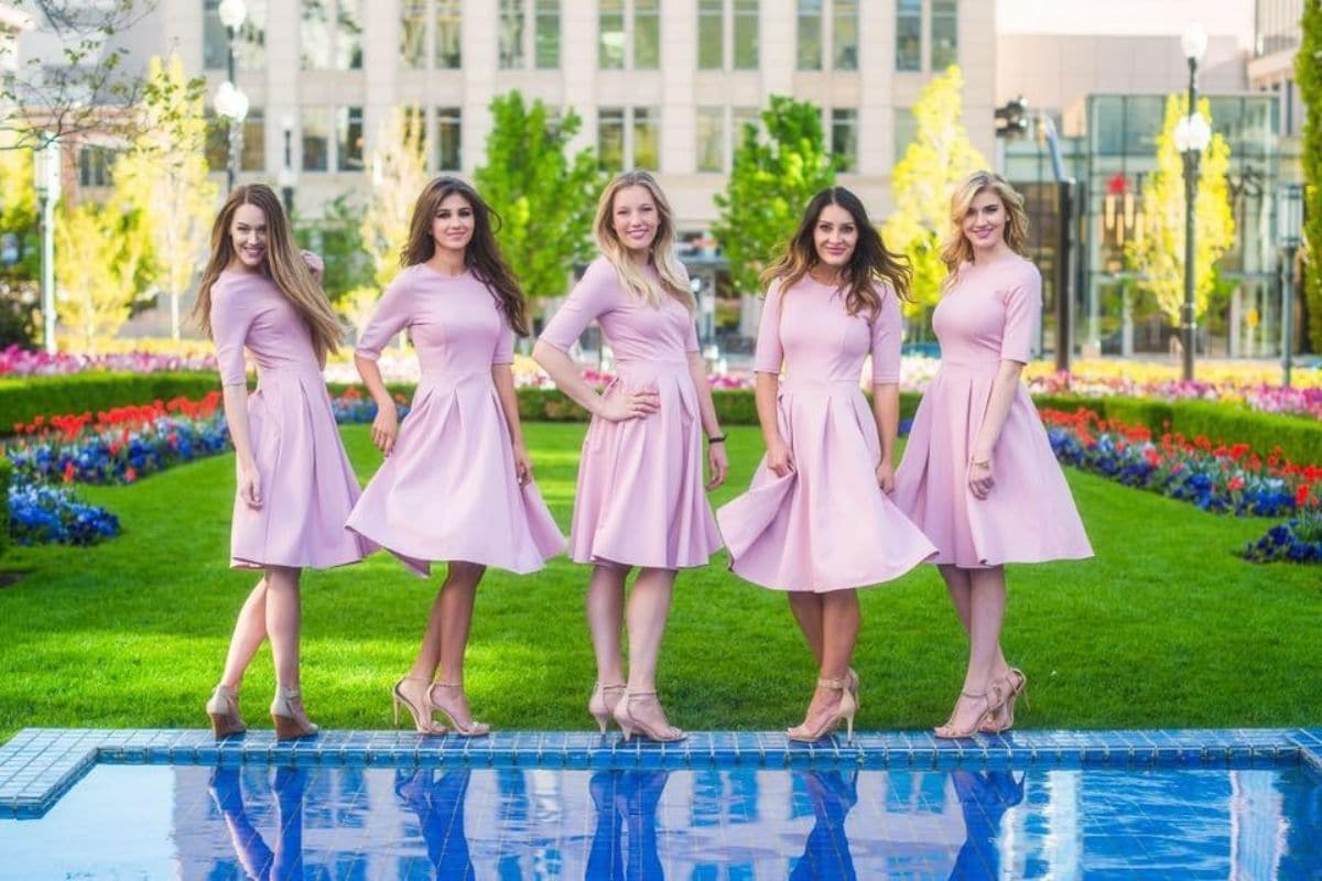 5 girls wearing pink dresses from sexy modest boutique