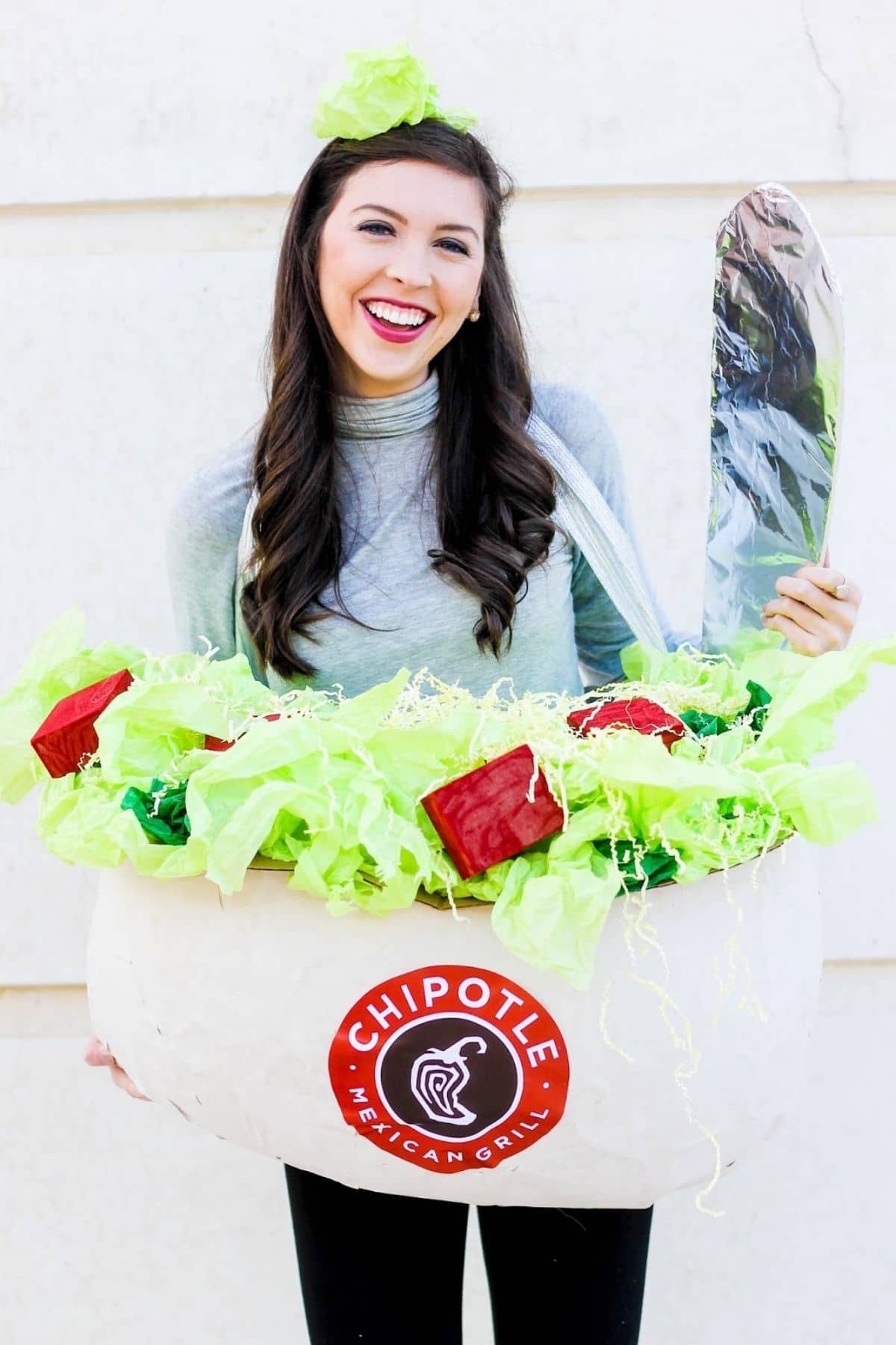 woman dressed up as a chipotle burrito