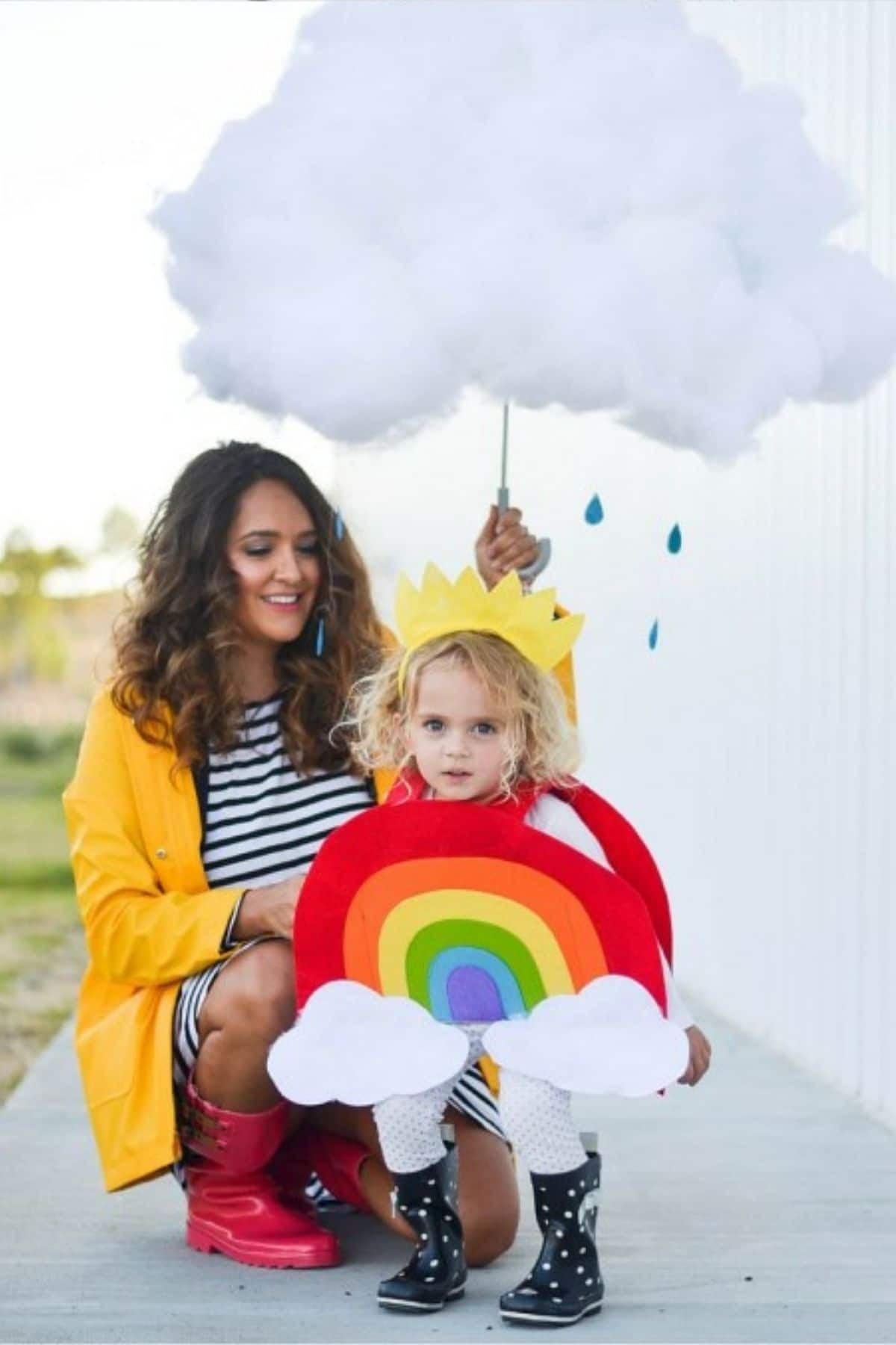 mom dressed up as a rain cloud and toddler dressed as a rainbow