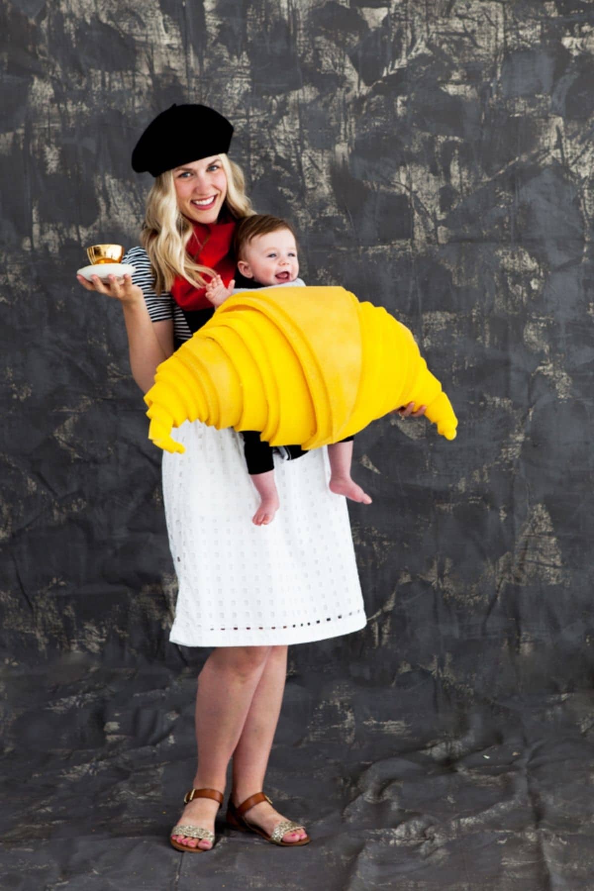 woman dressed up as a french baker and a baby dressed as a croissant