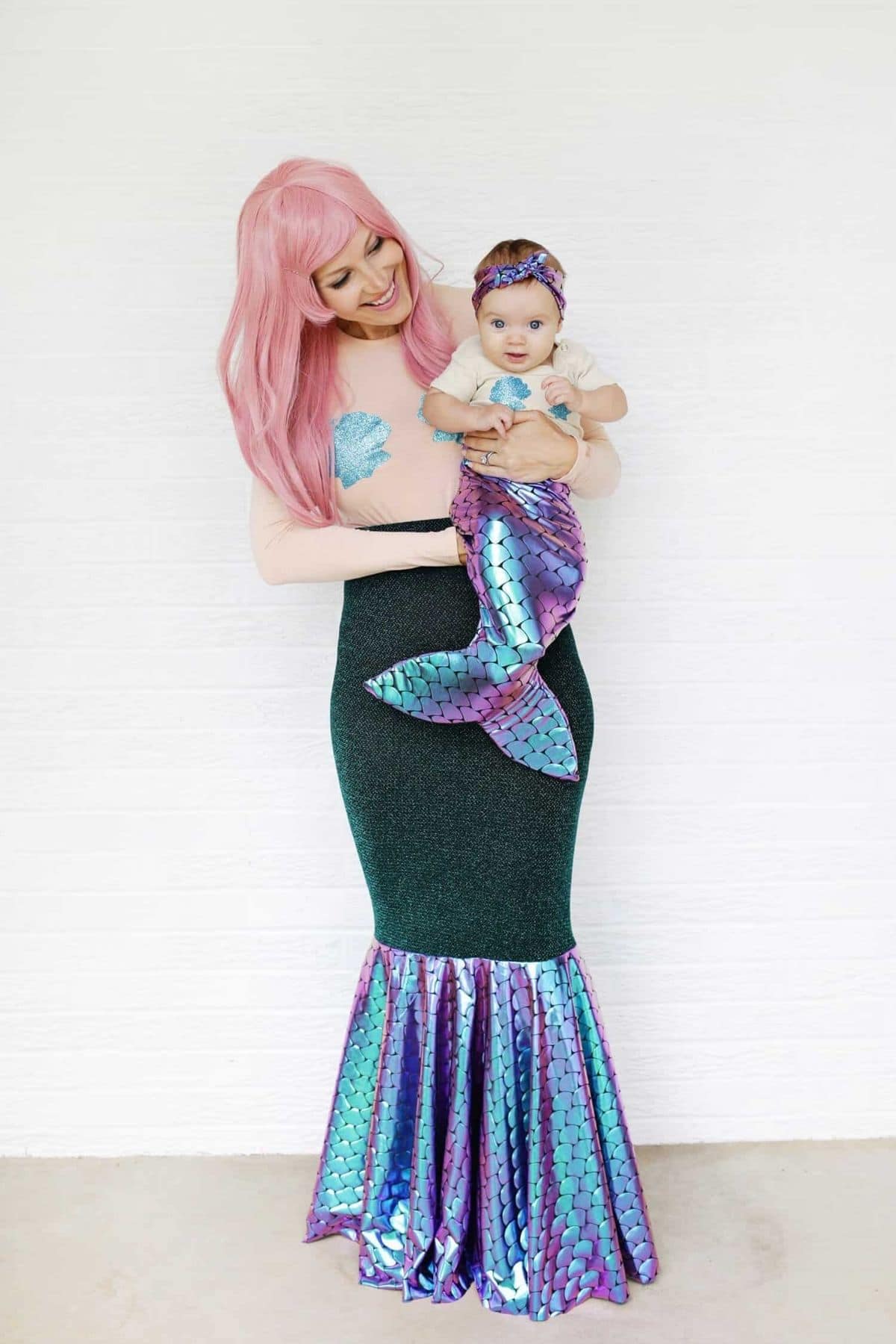 mother and daughter dressed up as mermaids together