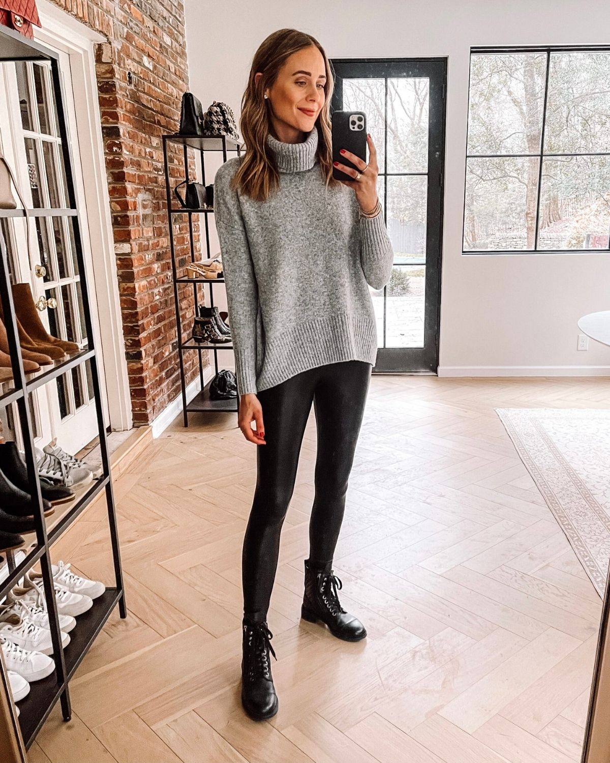 combat boots outfit that features a gray sweater