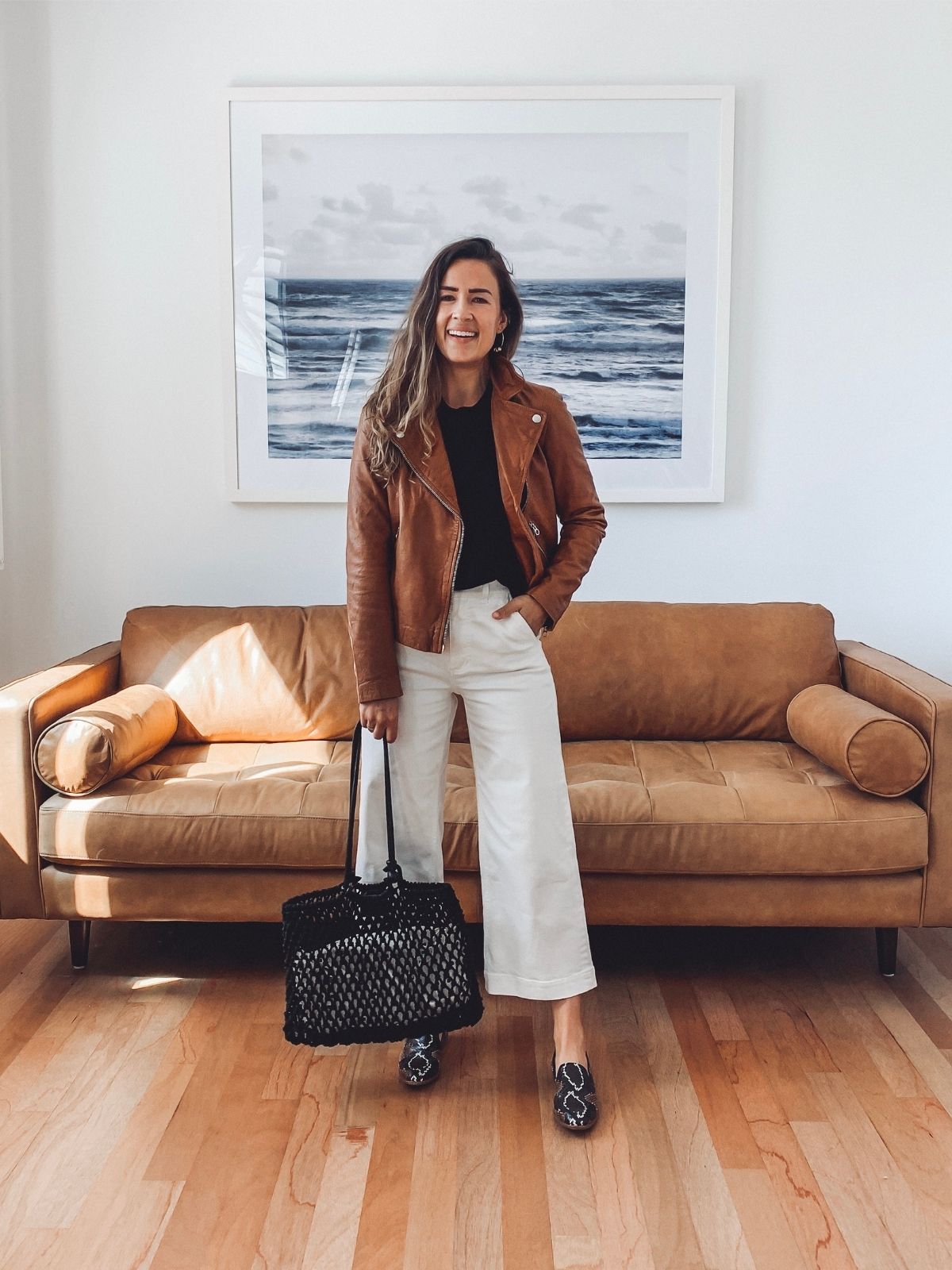 leather jacket outfit with white pants