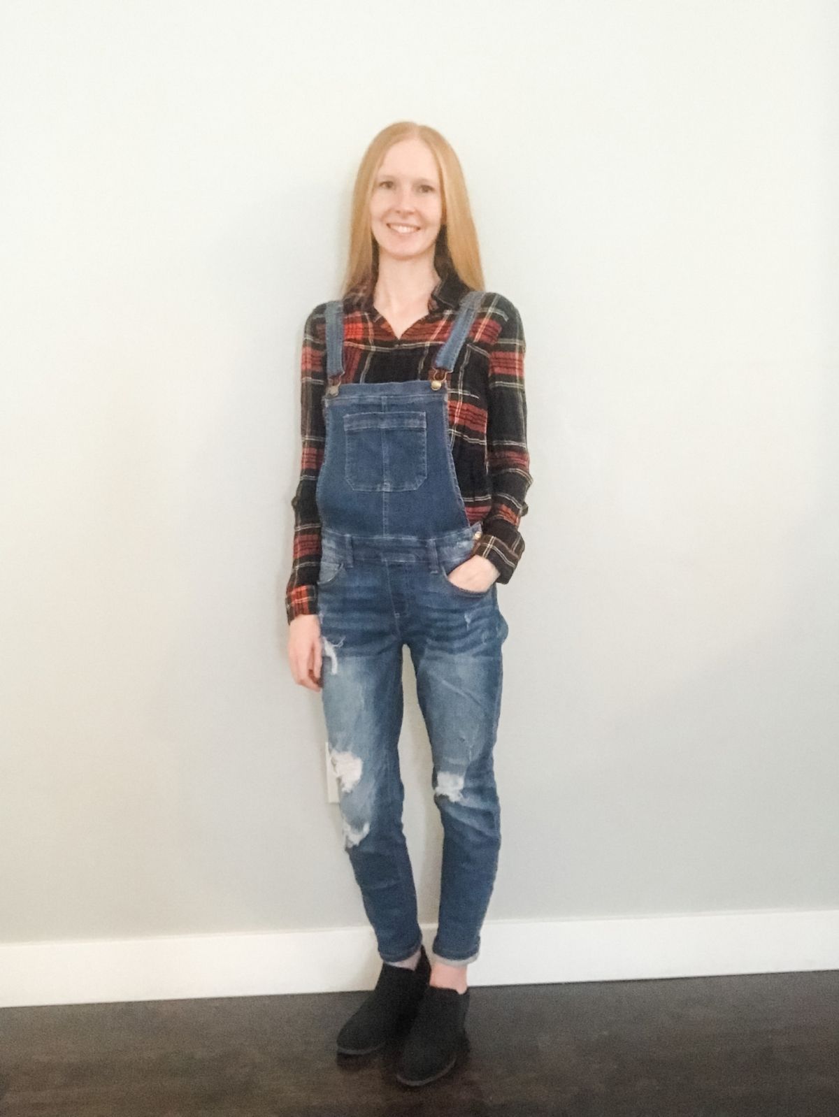 styling overalls with a plaid flannel shirt