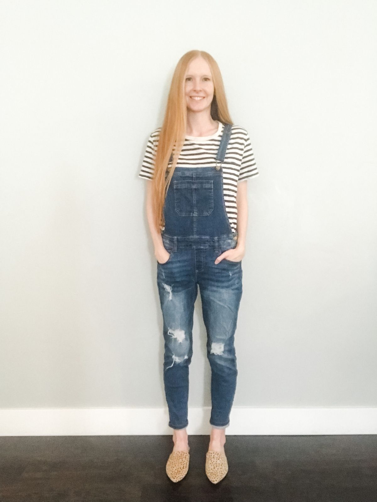styling overalls with a striped shirt