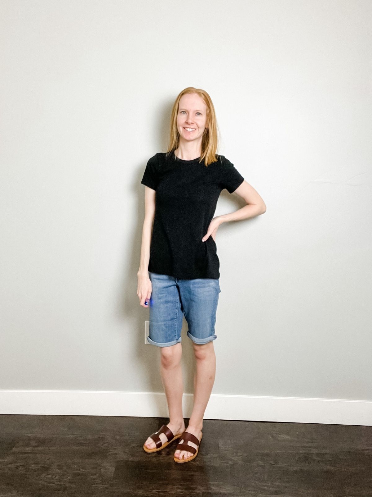 denim bermuda shorts styled with black top