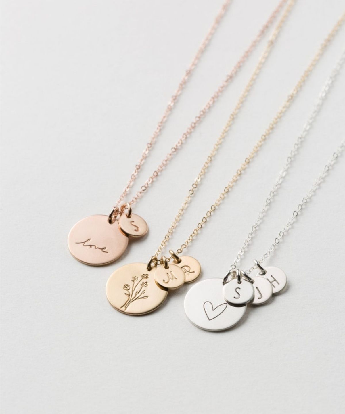 one gold, one rose gold, and one silver personalized necklace