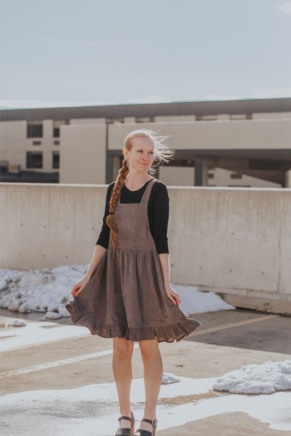 grey jumper dress with black shirt