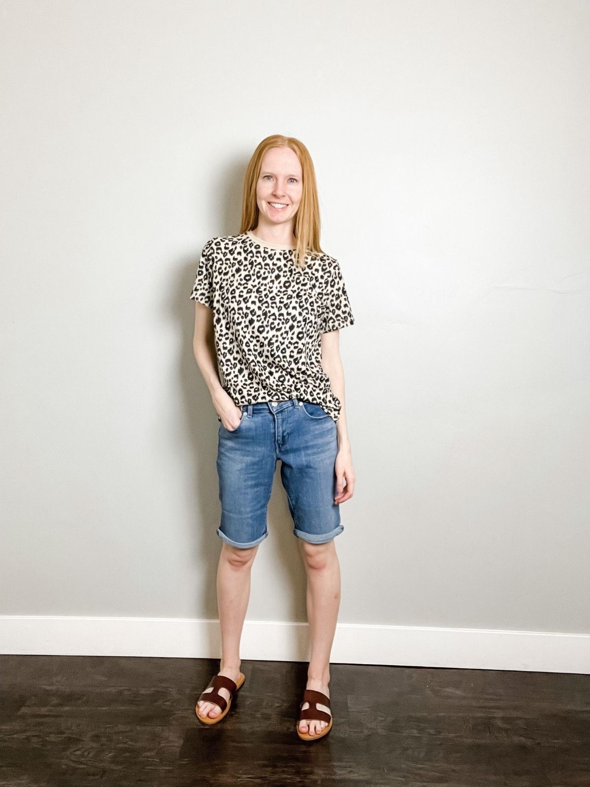 styling denim bermuda shorts with a leopard top