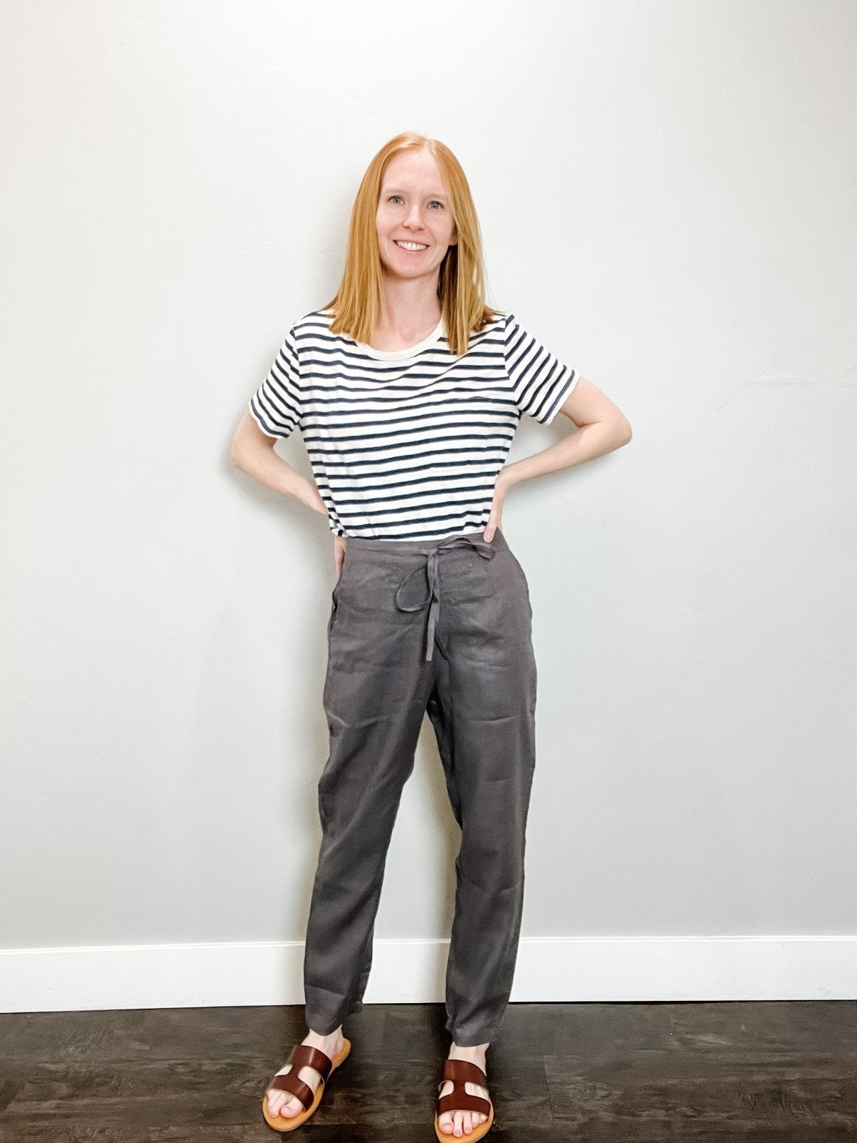 linen pants outfit with striped shirt and brown H sandals