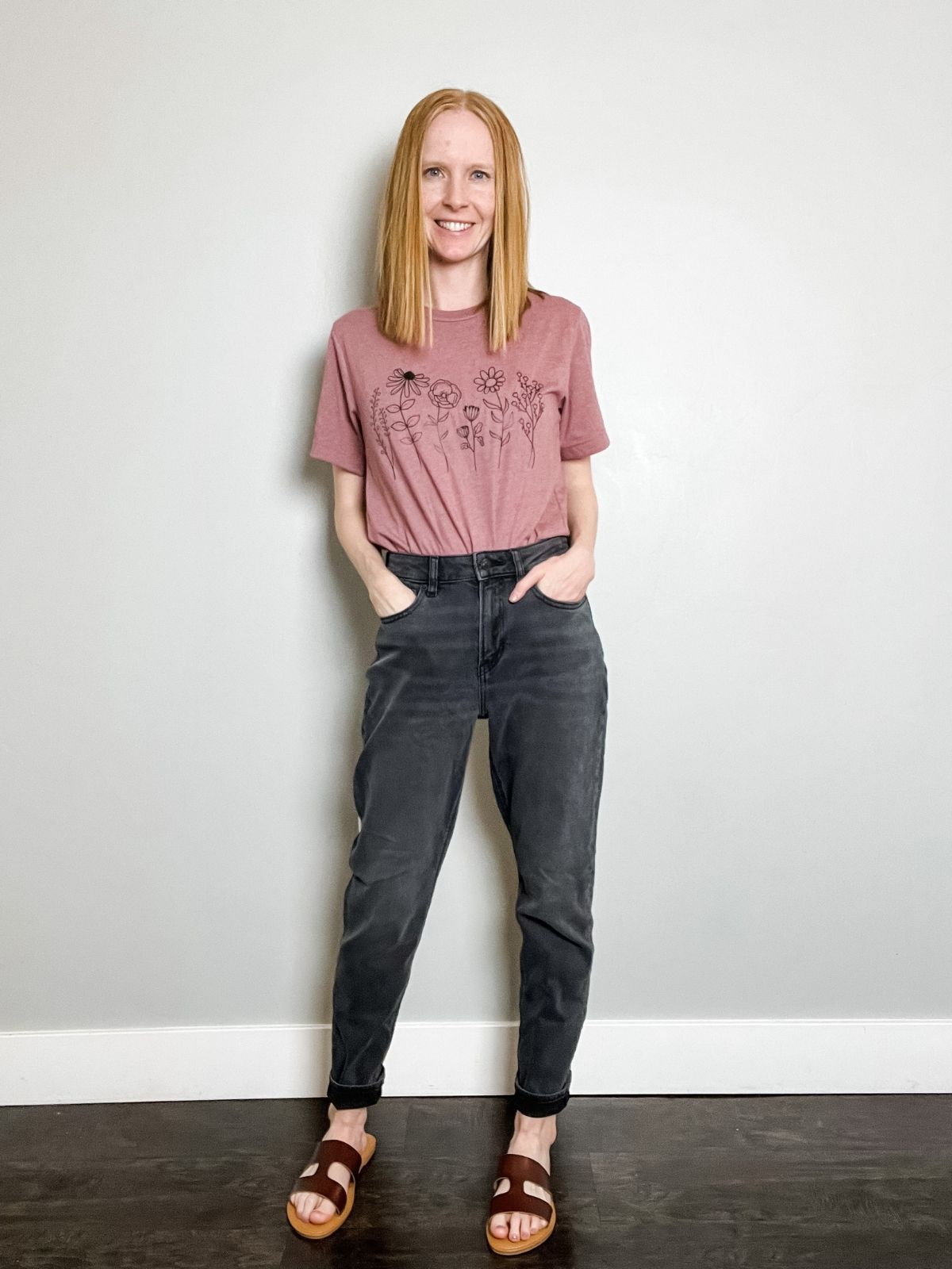 styling black jeans with graphic tee sandals