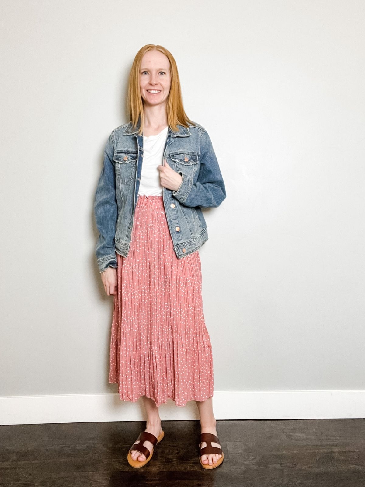 styling jean jacket with maxi skirt, white shirt, and brown sandals