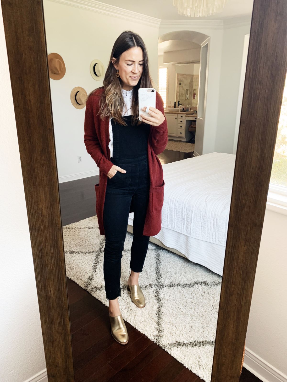 black overall outfit with red cardigan, white shirt, and gold shoes