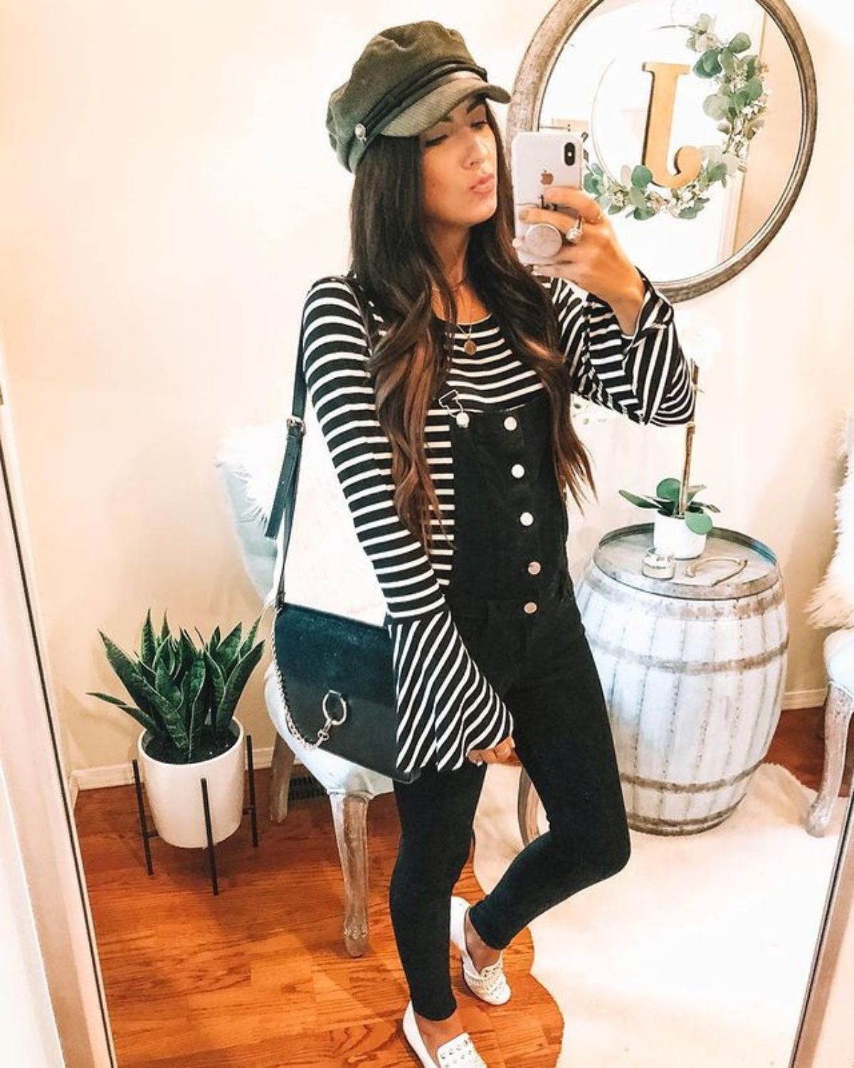 styling black overalls with striped top