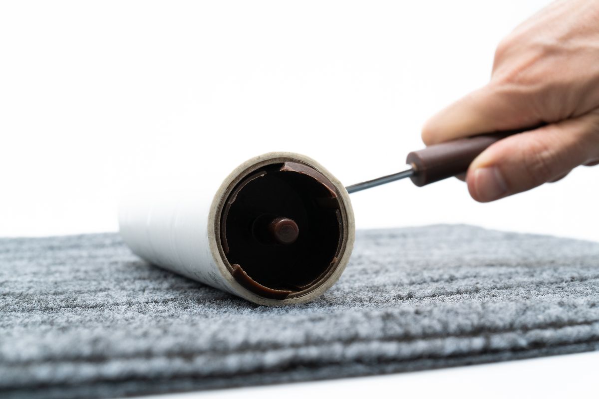 using a lint roller on clothes to prevent pilling