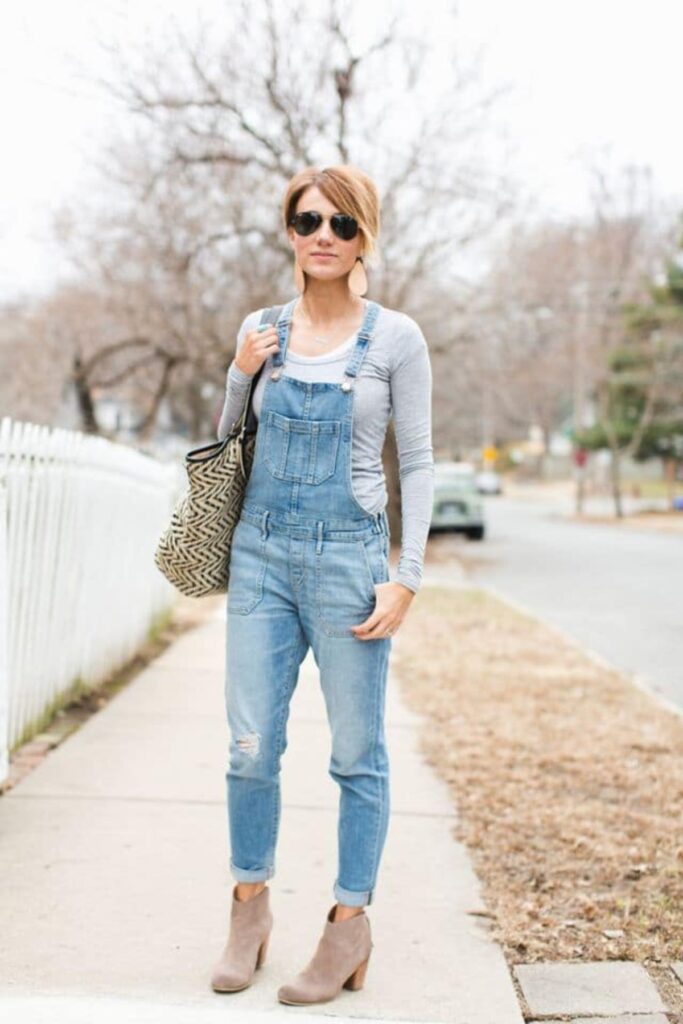 styling overalls with long sleeve gray shirt and booties
