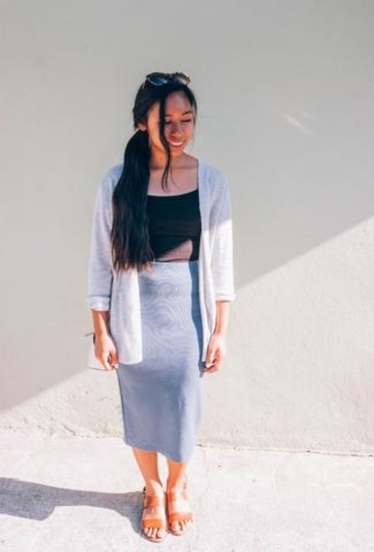 Blaze Ann wearing a gray pencil skirt