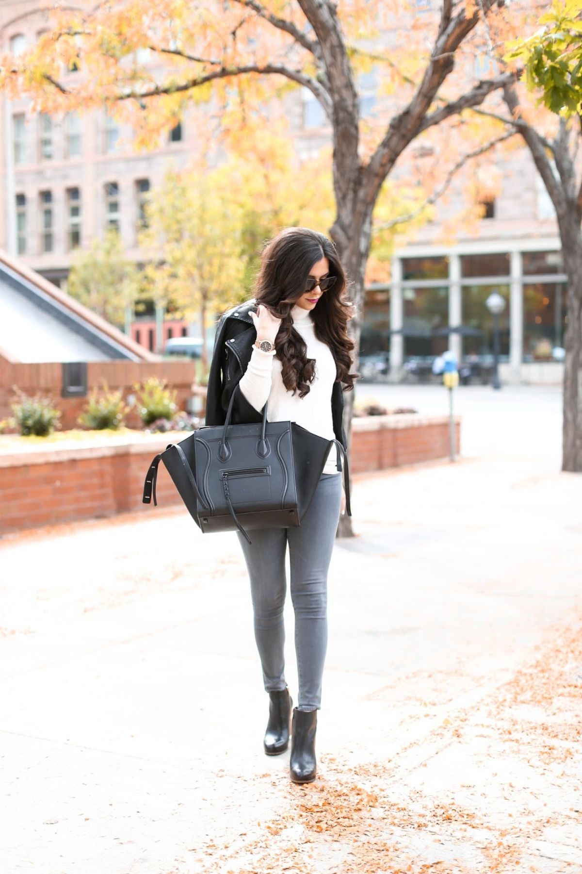 styling black booties with leather jacket