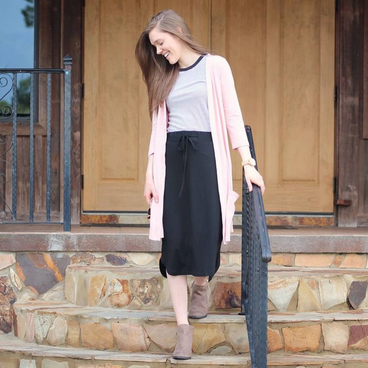 outfit featuring a long cardigan, black, skirt and brown booties