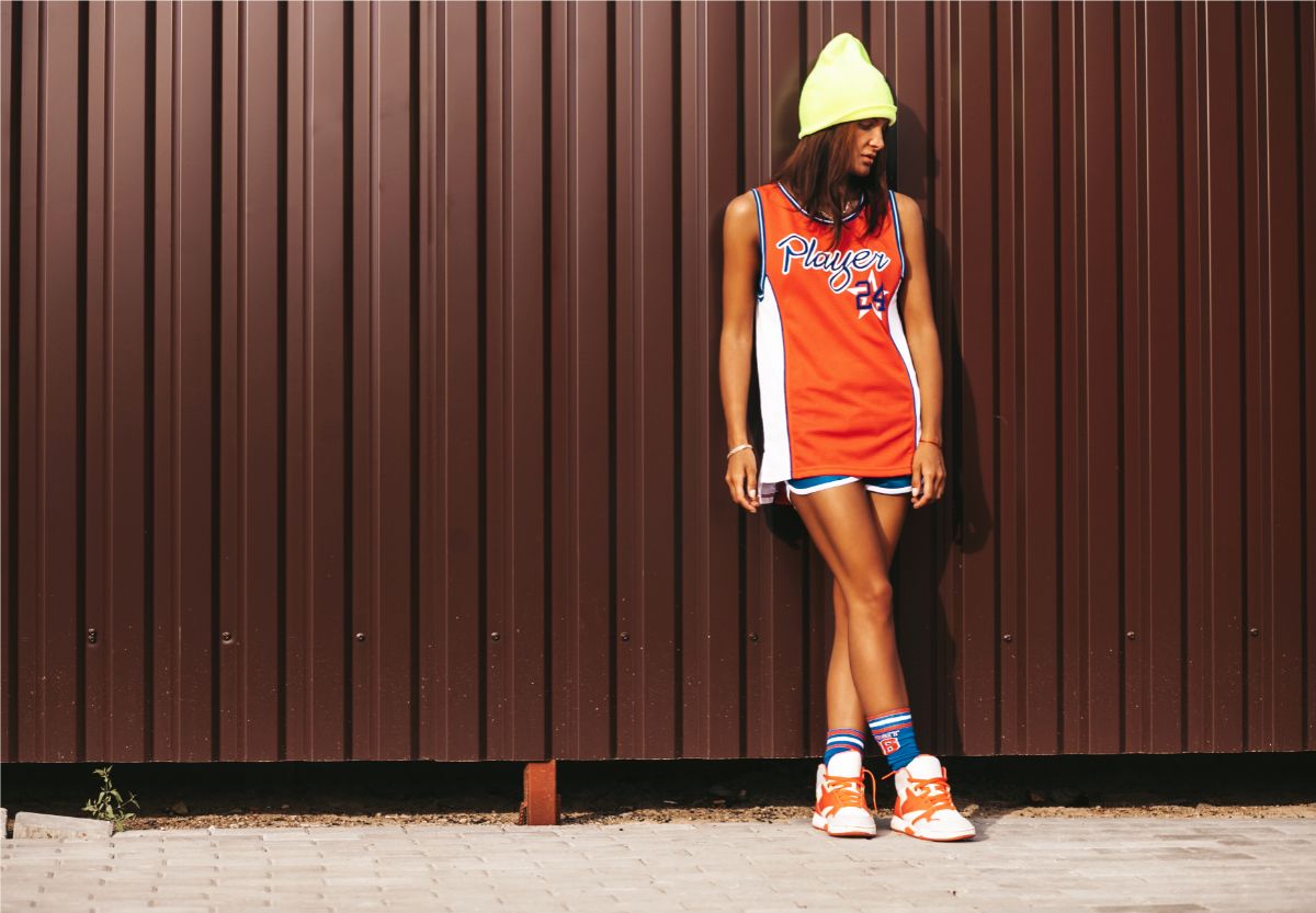 sporty woman wearing basketball jersey