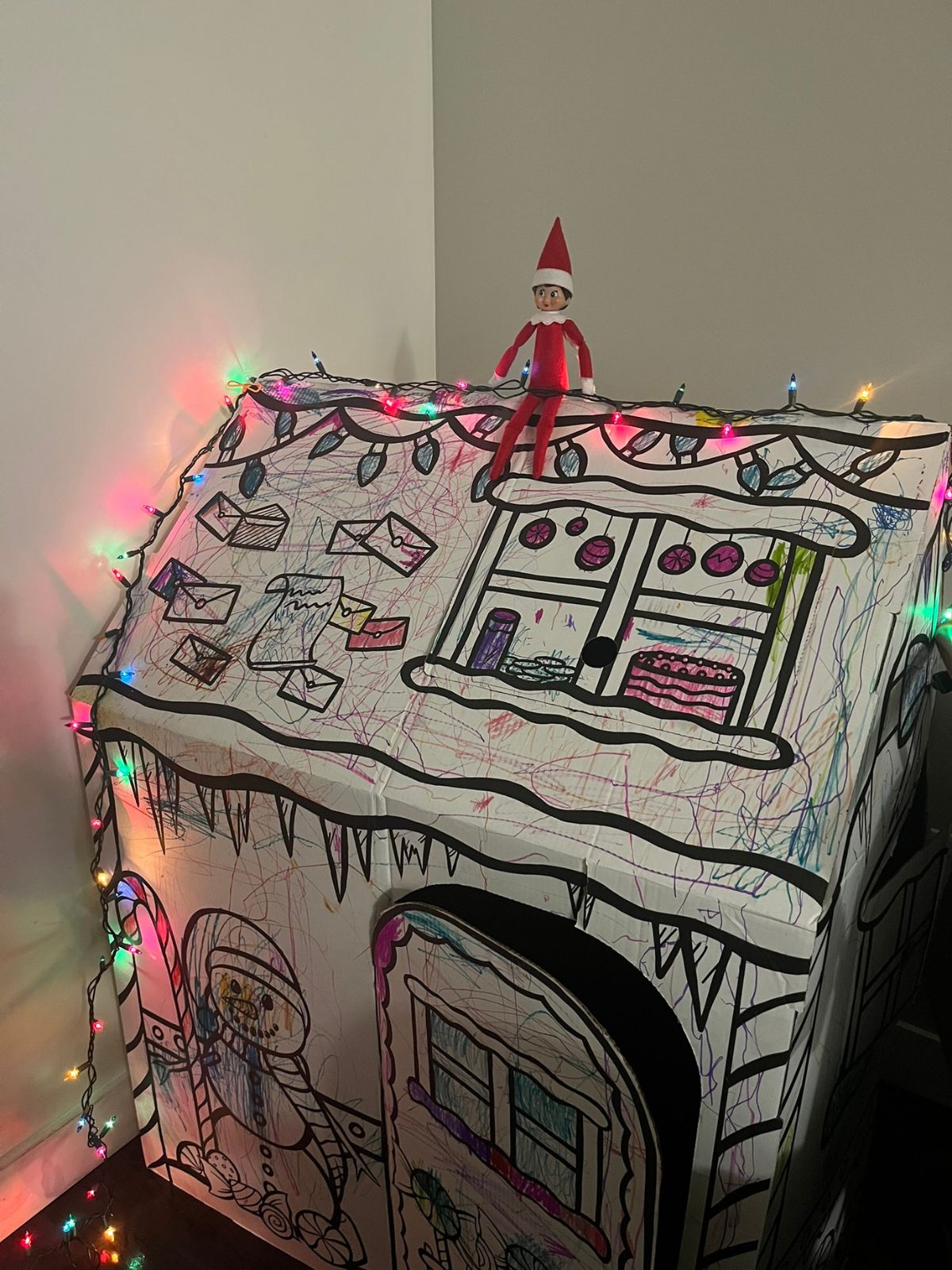 elf putting up christmas lights